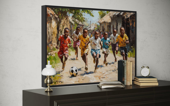 African Children Playing Soccer Framed Canvas Wall Art