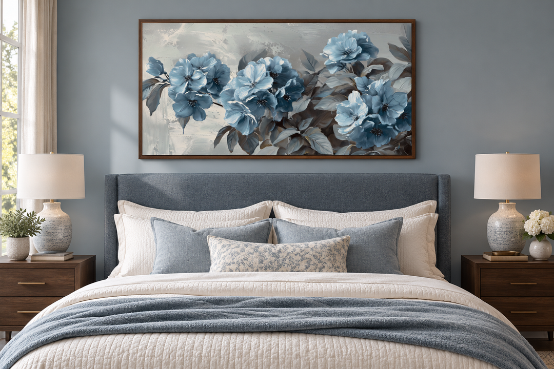 Abstract light blue floral canvas art above a bed in a modern grey and blue bedroom.