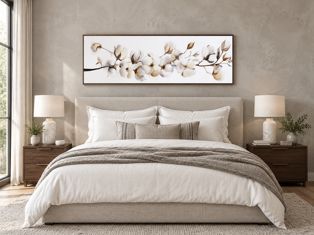 Boho long horizontal neutral cotton plant painting on canvas above a bed in a neutral bedroom.