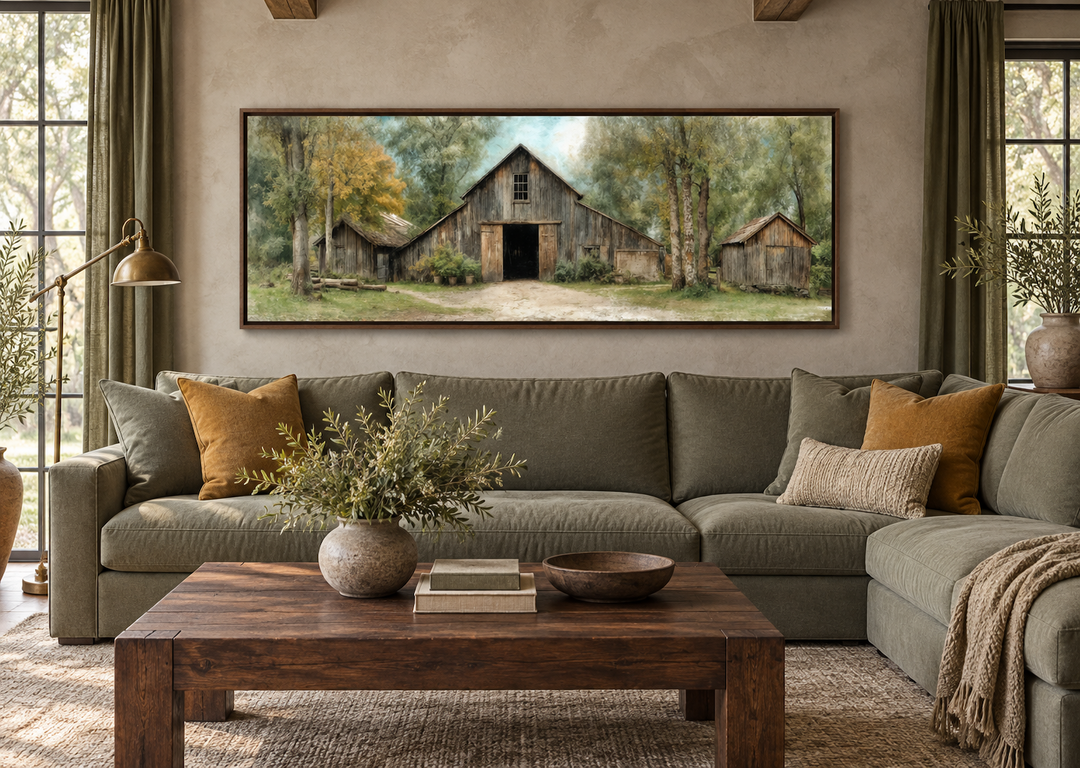 Rustic barn wall art in a walnut frame above a green sofa in a farmhouse living room.