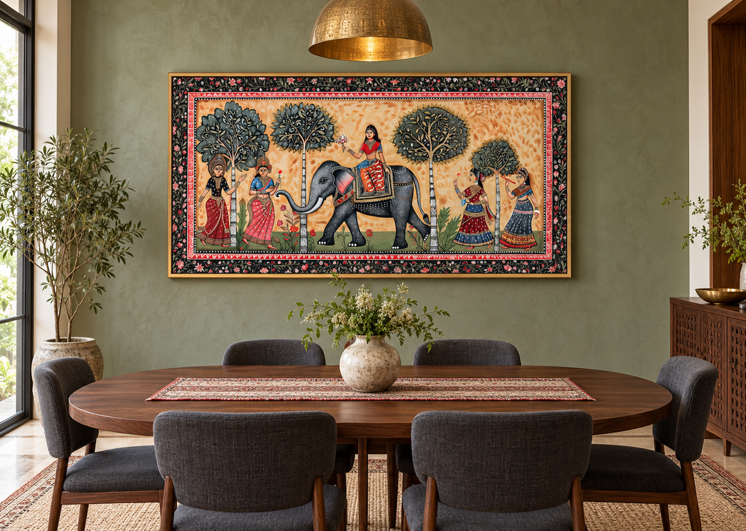 Framed Indian Madhubani style canvas painting of an elephant and women in a dining room.