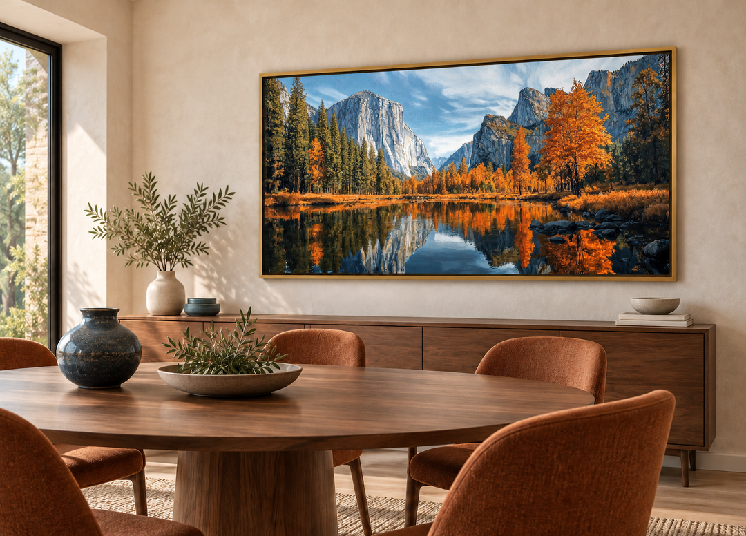 Yosemite National Park painting framed canvas wall art in a gold frame above a dining room sideboard.