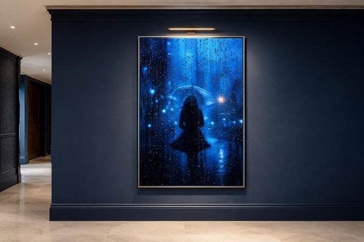 Vertical canvas wall art of a woman's silhouette walking in blue rain with a transparent umbrella.