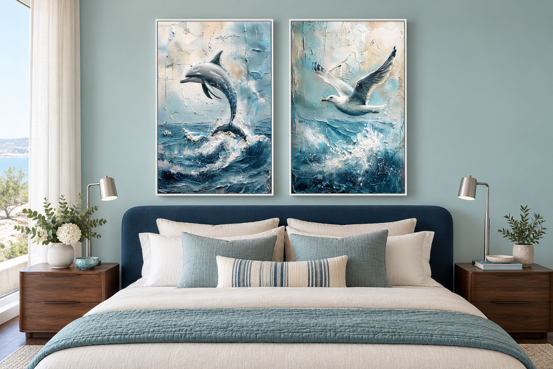 Set of 2 abstract coastal framed canvas art featuring a dolphin and a seagull over ocean waves.