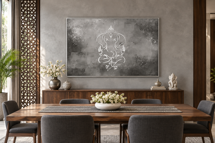 Minimalist Lord Ganesh framed canvas wall art in grey and silver tones above a dining table.