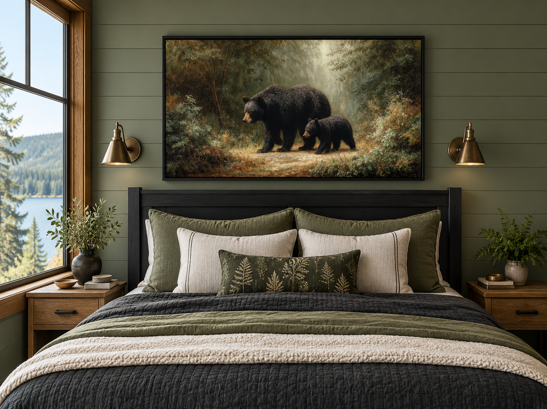 Black mama bear and cub walking through a sunlit forest canvas wall art above a bed.