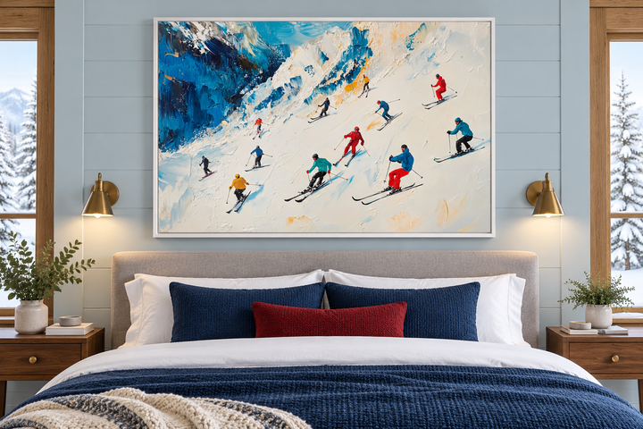 Colorful Skiers on Mountain Slope Framed Canvas Wall Art hanging above a bed in a cozy bedroom.