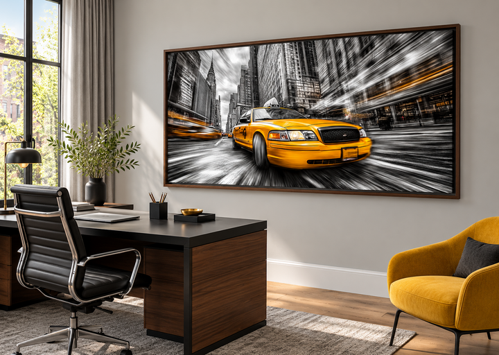 New York City yellow taxi graffiti style canvas wall art in a walnut frame above a modern desk.