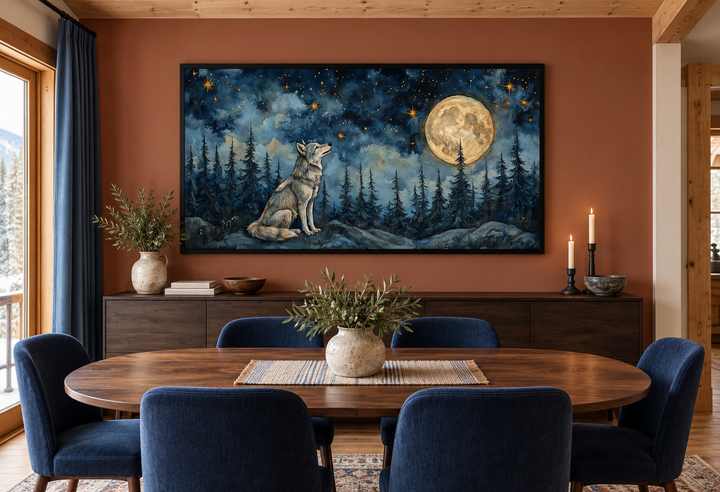 Wolf wall art canvas featuring a wolf under a full moon in a night forest, framed in a dining room.