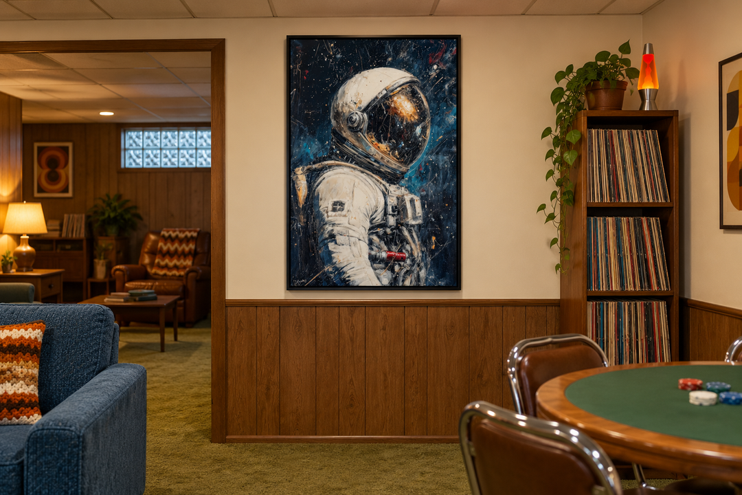 Astronaut Graffiti Framed Canvas Wall Art in a black frame hanging in a retro-style basement lounge.