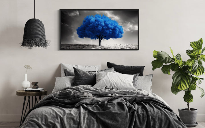 Blue Tree on Black White Background Framed Canvas Wall Art in a bedroom