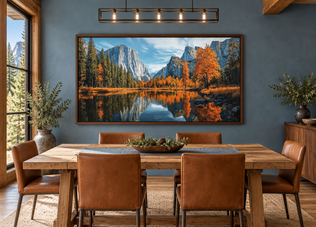Framed Yosemite National Park painting showing autumn trees and granite cliffs reflected in a river.