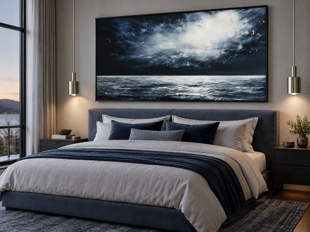 Dark horizontal starry night ocean seascape framed canvas wall art hanging above a modern bed.