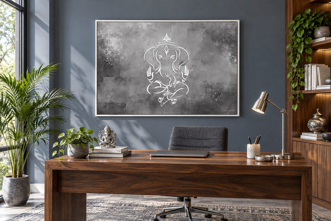 Minimalist Lord Ganesh framed canvas wall art in grey, silver, and white above a wooden desk.