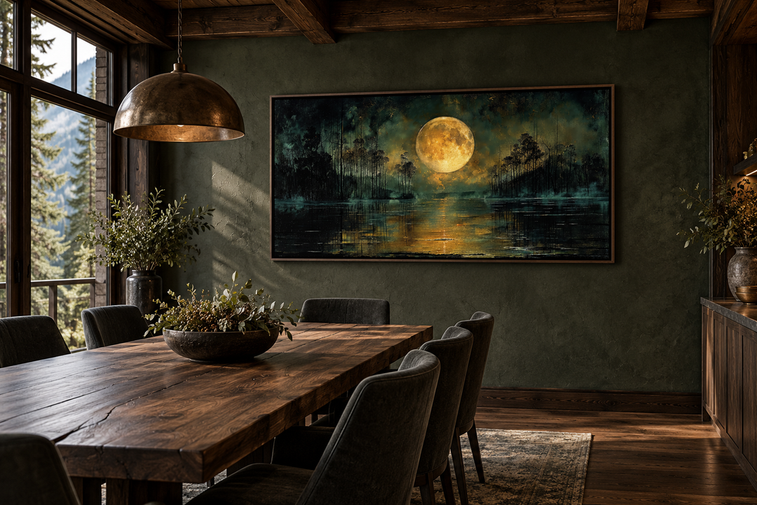 Gothic wall decor featuring a full yellow moon over a dark lake, framed on a green dining room wall.