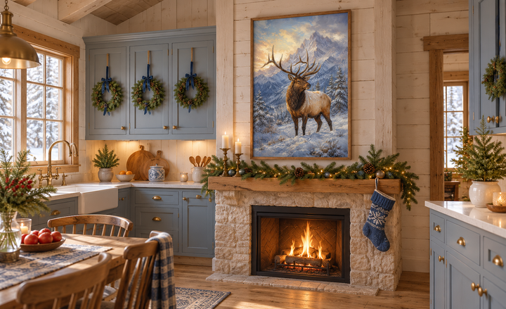 Elk in Snowy Mountains Framed Canvas Wall Art displayed above a fireplace in a rustic cabin kitchen.