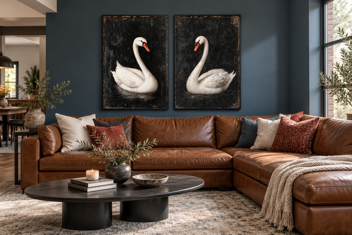 Set of two framed canvas wall art pieces featuring white swans on a textured black background.