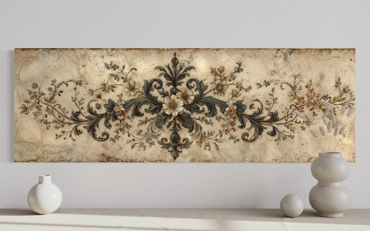 Antique neutral long narrow damask canvas wall art with floral scrollwork above a console table.