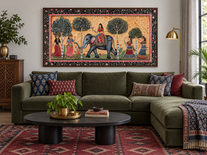 Framed Madhubani style canvas wall art of an Indian elephant and women in a traditional scene.