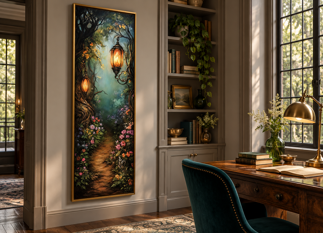 Tall narrow framed wall art of an enchanted forest pathway with glowing lanterns in a study.