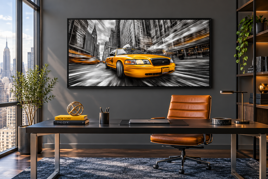 New York City yellow taxi graffiti style canvas wall art in a black frame above a modern desk.