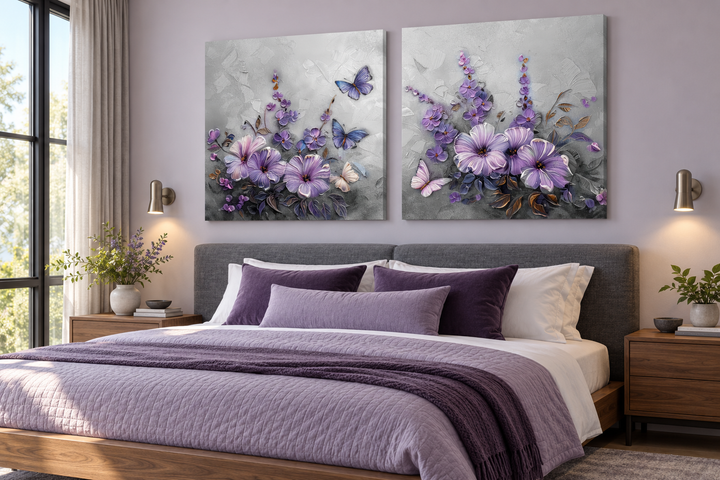 Set of 2 light purple floral prints with lavender blossoms and butterflies above a bed.