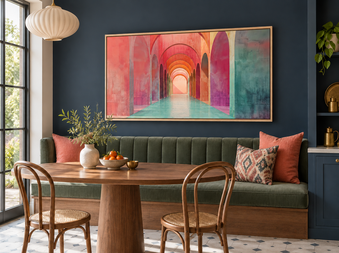 Mediterranean Archways wall art in a light wood frame above a green banquette in a dining nook.