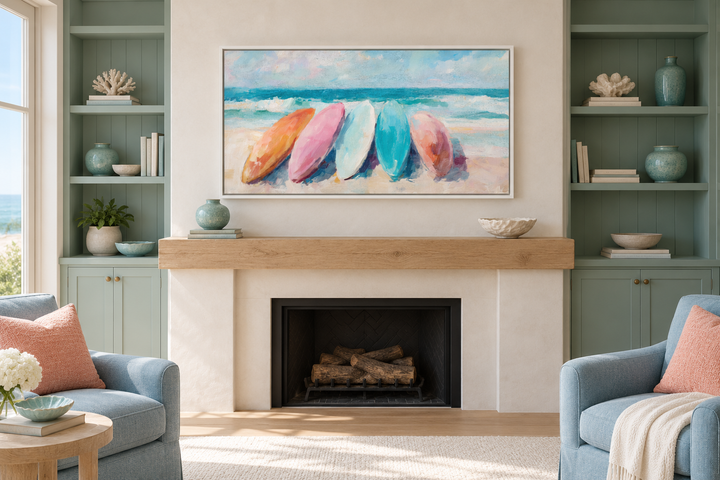 Coastal canvas wall art with pastel surfboards above a fireplace in a beach house living room.