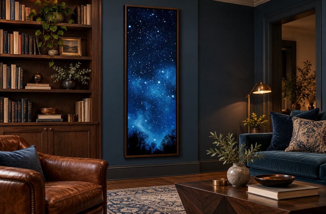 Tall narrow vertical framed canvas wall art featuring a navy blue starry Milky Way night sky.