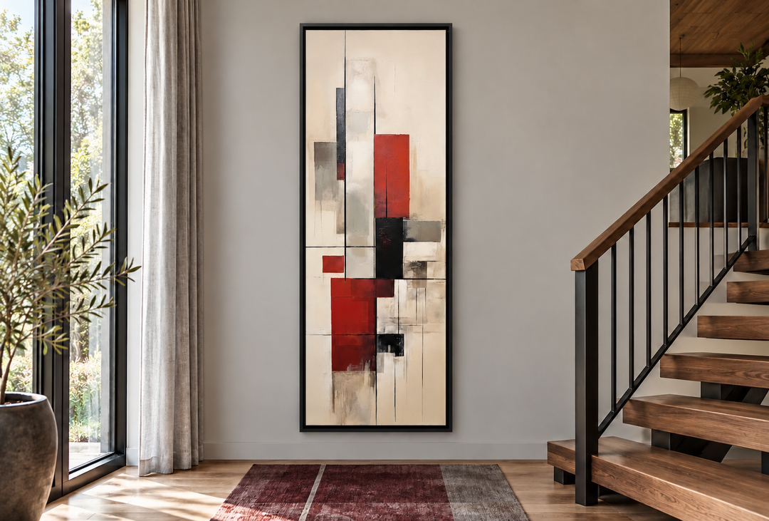 Vertical mid-century modern framed canvas wall art with red and black geometric shapes in a hallway.