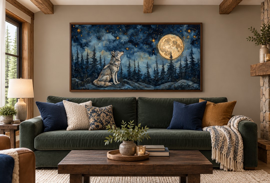 Wolf wall art canvas under a full moon in a night forest, framed above a green sofa in a rustic room.