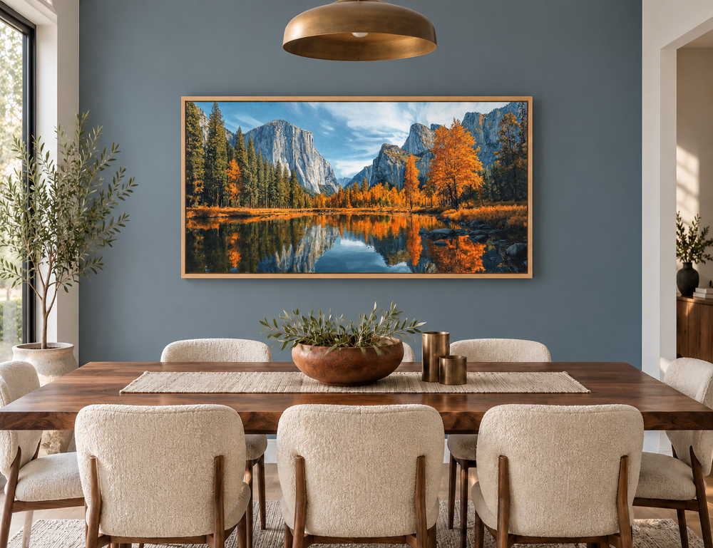 Yosemite National Park painting on framed canvas above a dining table in a modern blue-grey room.