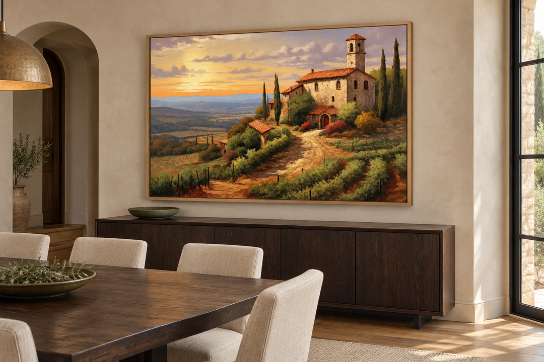 Framed canvas painting of a Tuscan villa on rolling hills at sunset in a modern dining room.