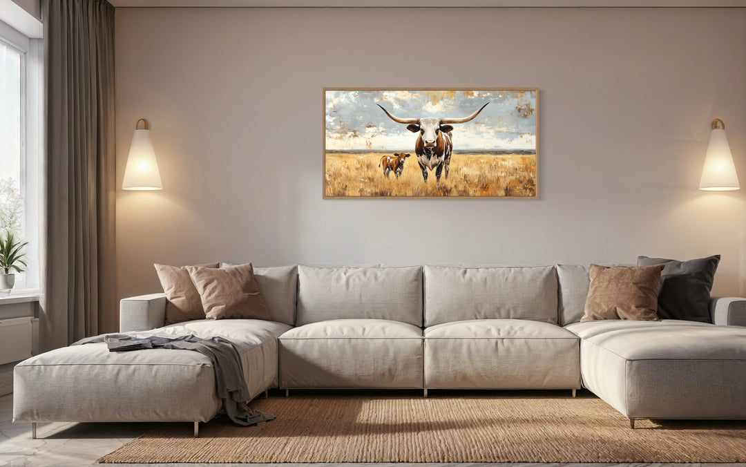 Texas Longhorn Cow With Calf In The Field Framed Canvas Wall Art above beige couch