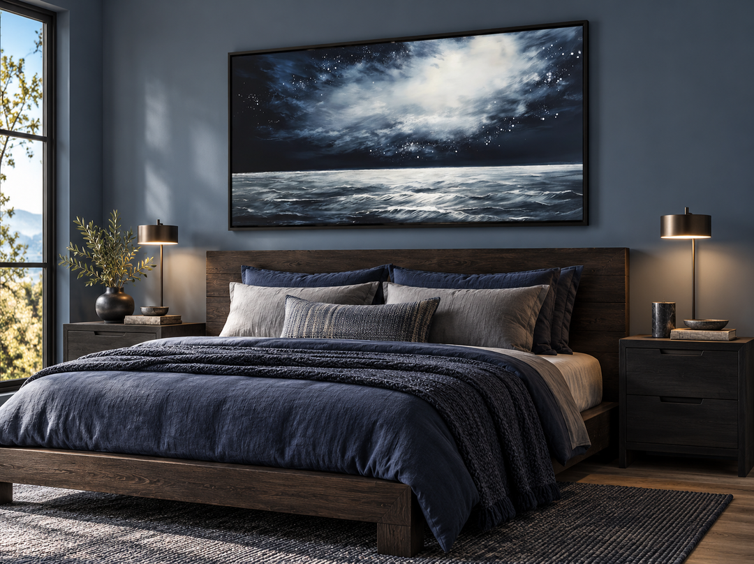 Dark horizontal starry night ocean seascape framed canvas wall art hanging above a bed.