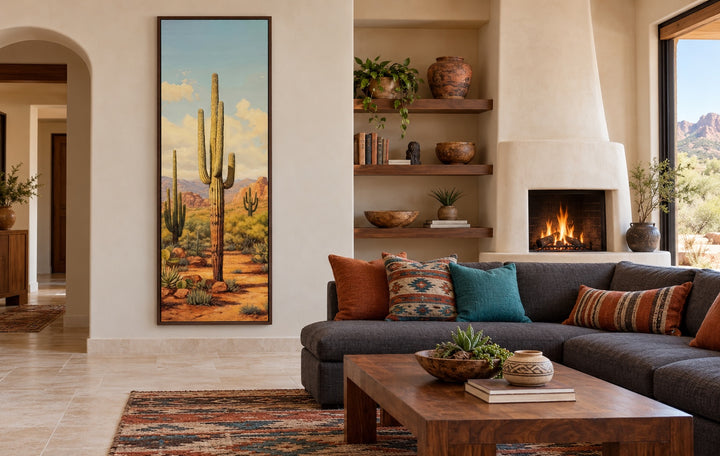 Tall vertical saguaro cactus canvas wall art in a Southwestern living room with a walnut frame.