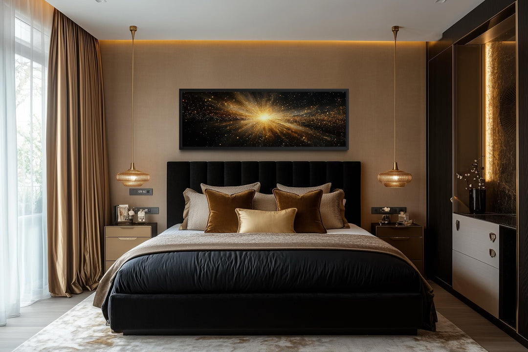 Horizontal abstract black and gold starburst wall art displayed above a bed in a modern bedroom.