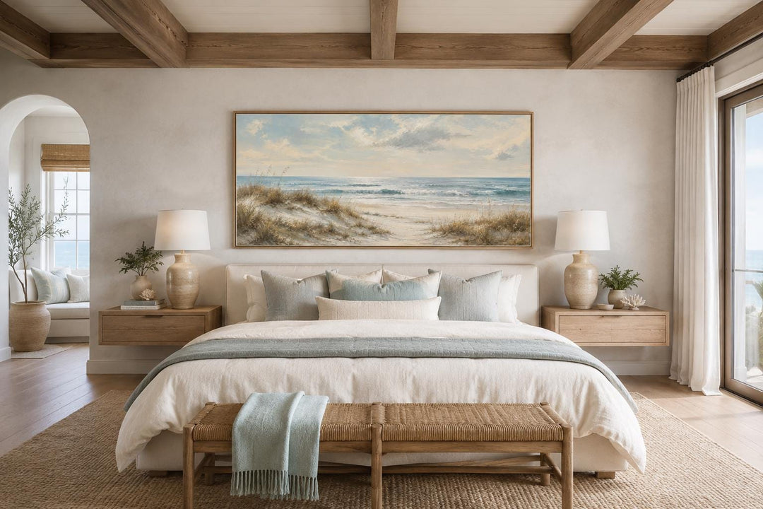 Wide horizontal wall art of sandy beach dunes, sea grass, and rolling waves in a slim gold frame.