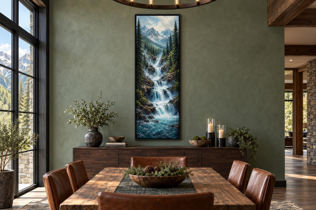 Tall narrow canvas wall art of a cascading mountain waterfall through a pine forest in a dining room