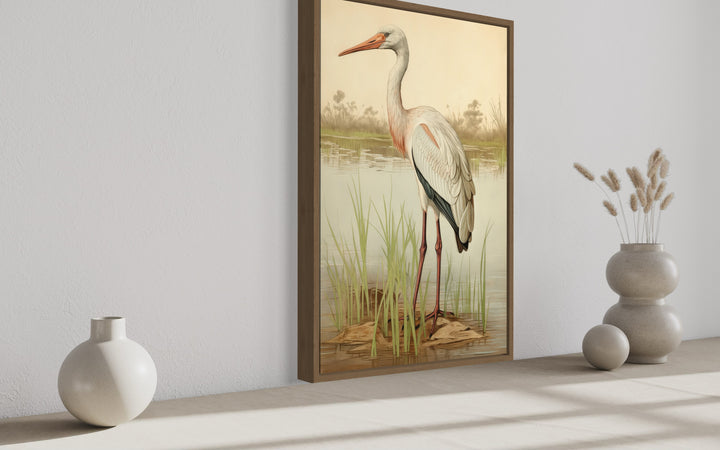 a painting of a white stork standing in the water