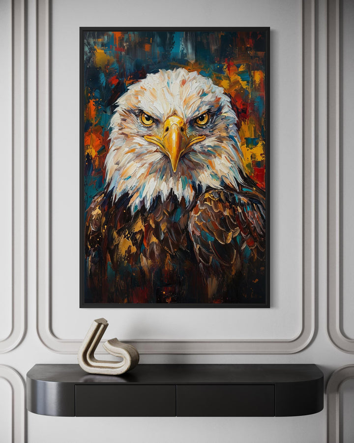 Abstract bald eagle portrait canvas wall art in a black frame above a modern console table.