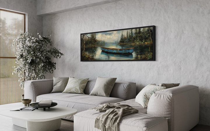 Old Blue Canoe In The Lake Long Horizontal Framed Canvas Wall Art above grey couch side view