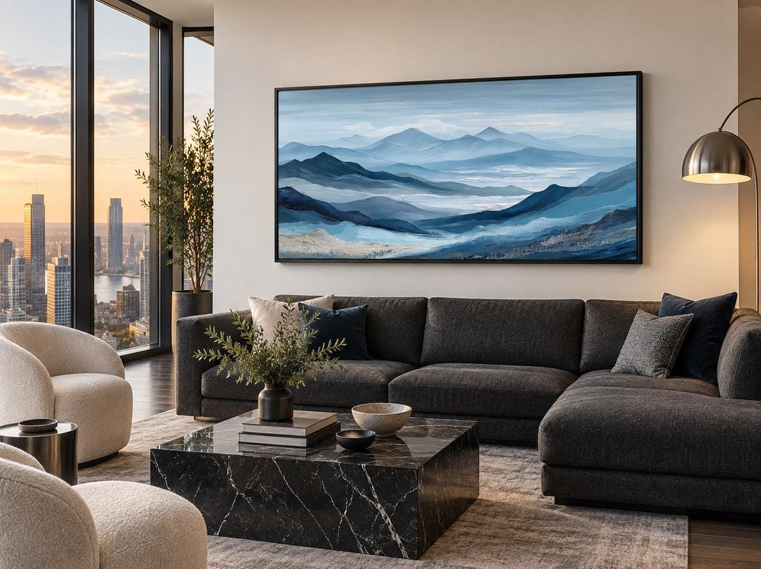 Blue Mountain Serene Nature Landscape Canvas Wall Art above a dark gray sectional sofa.