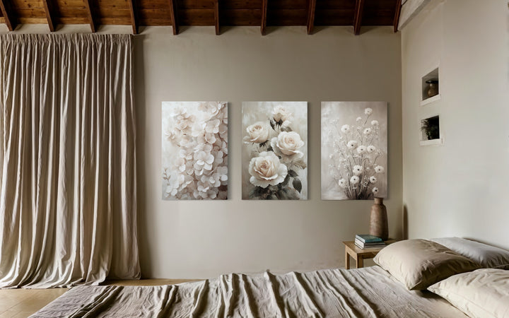 3 Piece Neutral Boho Floral Farmhouse Framed Canvas Wall Art in a bed room with a neatly made bed