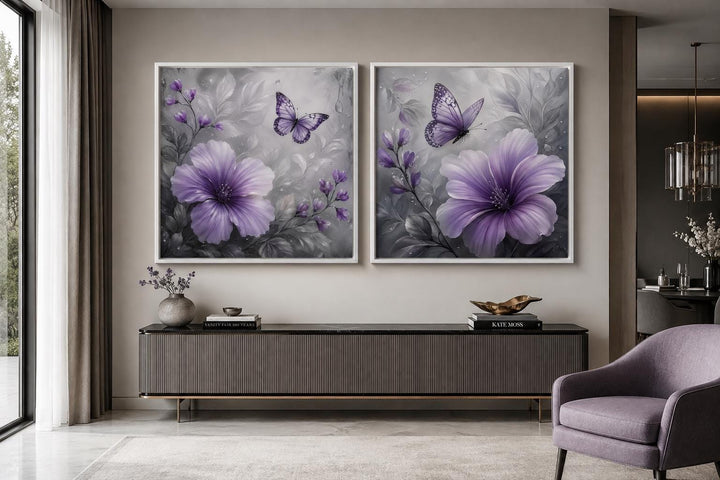 Set of 2 purple hibiscus flower wall art prints with butterflies on a moody gray floral background.