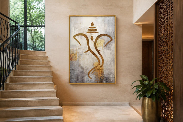Minimalist Lord Ganesha canvas wall art in gold and silver on a textured neutral background.