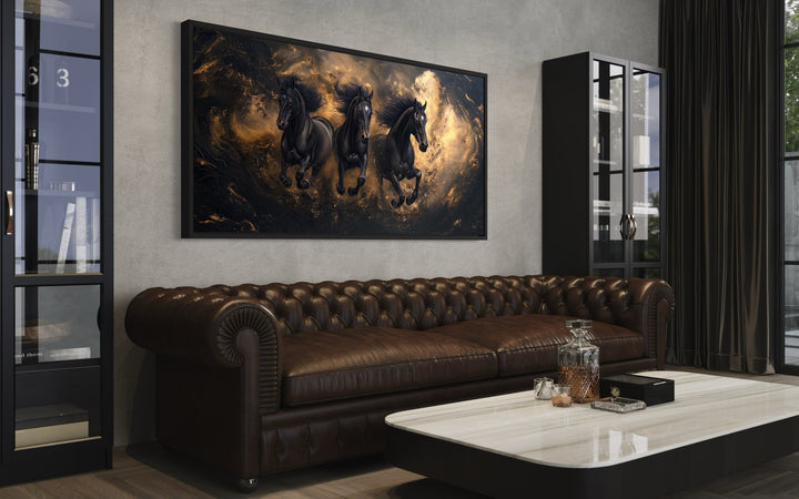 Three Running Stallions On Black Gold Background Framed Canvas Wall Art a living room with a couch