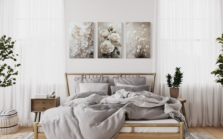 3 Piece Neutral Boho Floral Farmhouse Framed Canvas Wall Art in a bedroom with a bed