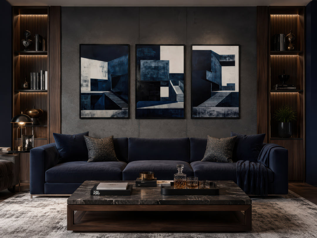 3 piece mid century modern navy blue architectural wall art set above a dark blue velvet sofa.