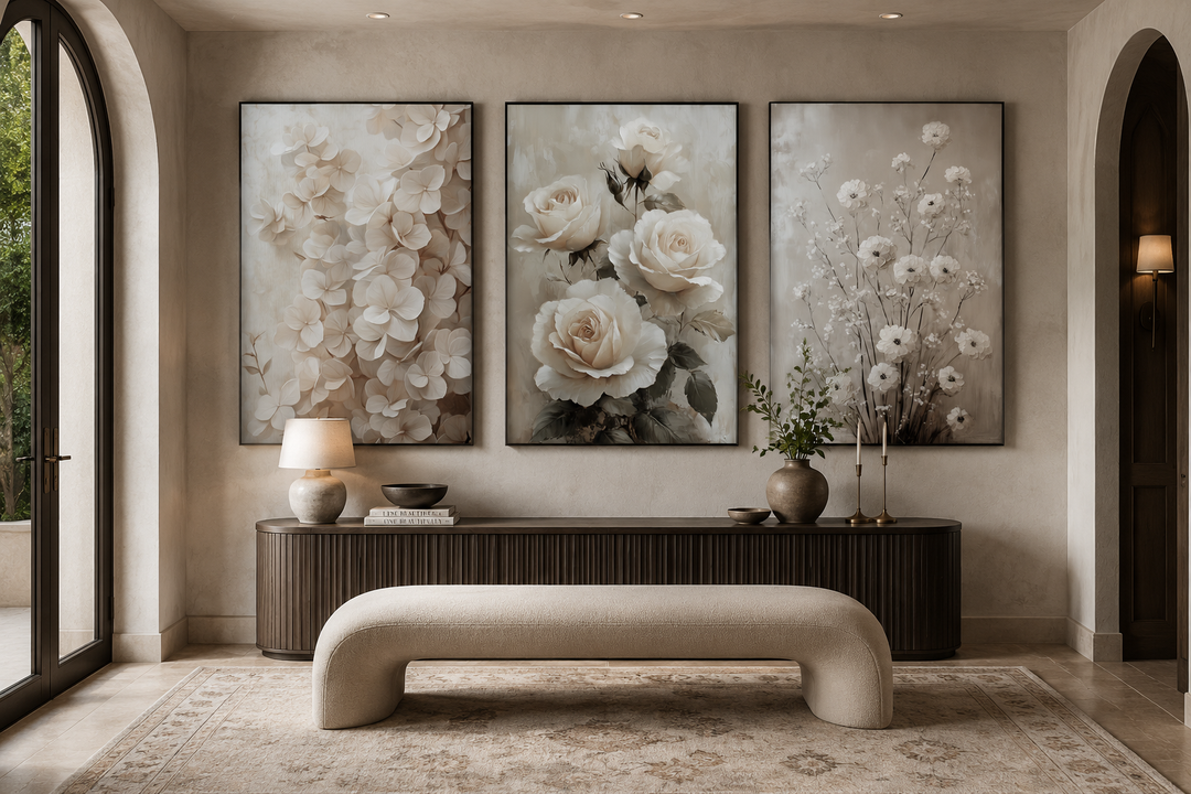 Three-piece framed canvas wall art set featuring neutral beige floral designs in a boho living room.